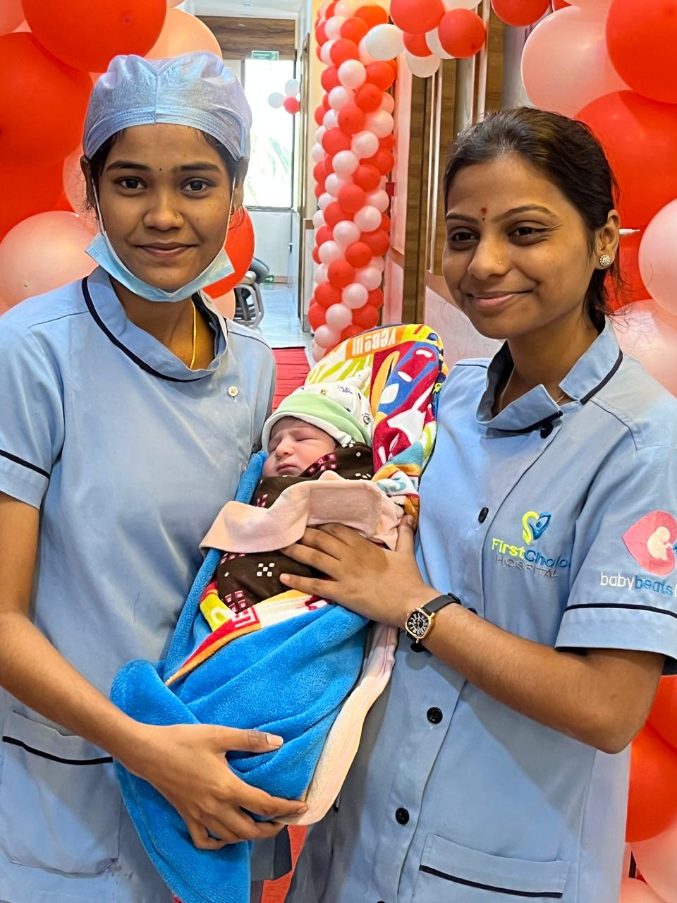 Staff enjoy time with baby.